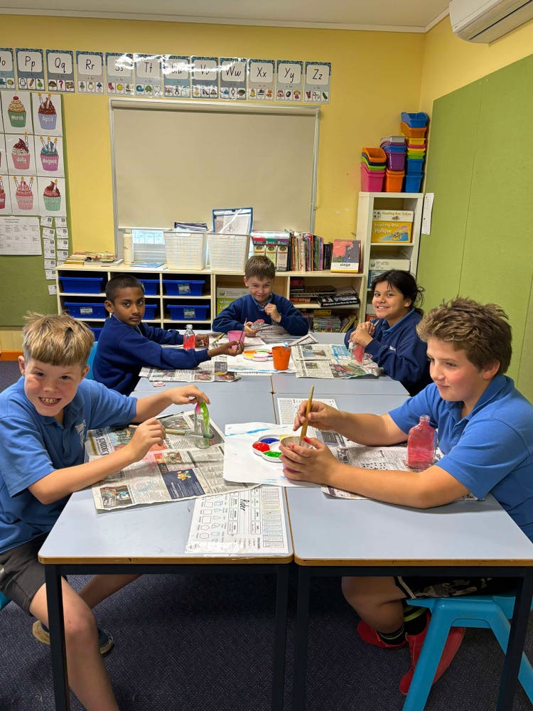 An image of a group of students during an art lesson.